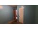 This bedroom has blue walls, multiple doors, and in need of cleaning at 45 James P Brawley Nw Dr, Atlanta, GA 30314