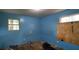 A bedroom features a window and light blue walls at 45 James P Brawley Nw Dr, Atlanta, GA 30314