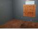 This bedroom is in need of repair and the window is boarded at 45 James P Brawley Nw Dr, Atlanta, GA 30314
