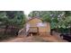 Modest one-story home with wooden porch and natural landscaping at 45 James P Brawley Nw Dr, Atlanta, GA 30314