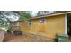 The house has a wood exterior, several windows, and a back entrance at 45 James P Brawley Nw Dr, Atlanta, GA 30314