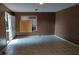 An empty room featuring stained tile floors and a boarded up window at 45 James P Brawley Nw Dr, Atlanta, GA 30314