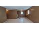 An empty room featuring stained tile floors and a boarded up window at 45 James P Brawley Nw Dr, Atlanta, GA 30314