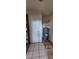 Utility room showcasing water heater, and door with stained tiled floors at 45 James P Brawley Nw Dr, Atlanta, GA 30314