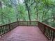 Wood deck in a wooded and private back yard setting perfect for entertaining at 4911 Hairston Pl, Stone Mountain, GA 30088