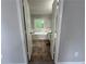 Bathroom with large soaking tub visible through doorway at 4911 Hairston Pl, Stone Mountain, GA 30088
