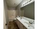 Neutral bathroom featuring a dual sink vanity with a shower and tub combination at 4911 Hairston Pl, Stone Mountain, GA 30088