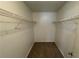 Walk in closet with carpet and shelving at 4911 Hairston Pl, Stone Mountain, GA 30088