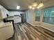 Eat-in kitchen featuring stainless steel appliances, white cabinetry, and a view of the outdoors at 4911 Hairston Pl, Stone Mountain, GA 30088