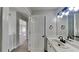 Bathroom with single sink vanity and an open doorway leading to another room at 5368 Knights Lndg, Ellenwood, GA 30294