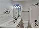 Bathroom showcasing a single sink vanity and standard toilet with shower access at 5368 Knights Lndg, Ellenwood, GA 30294
