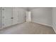 Neutral bedroom features carpet floors, double door closet, and ensuite bathroom access at 5368 Knights Lndg, Ellenwood, GA 30294