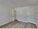 Bedroom showcasing modern wood floors, neutral paint, and a walk-in closet at 5368 Knights Lndg, Ellenwood, GA 30294