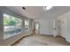 Living room featuring modern wood floors, multiple windows, and neutral paint at 5368 Knights Lndg, Ellenwood, GA 30294