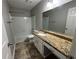 Bathroom featuring a vanity with granite countertops, a white toilet, and a shower-over-tub at 675 Stonebridge Loop, Lithonia, GA 30058