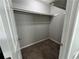 Walk-in closet featuring carpet flooring, and a single shelf with a hanging bar at 675 Stonebridge Loop, Lithonia, GA 30058