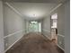 Light-filled dining room with chandelier and chair rail at 675 Stonebridge Loop, Lithonia, GA 30058