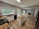 Modern kitchen with island, granite countertops and stainless steel appliances at 675 Stonebridge Loop, Lithonia, GA 30058