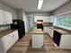 Bright kitchen boasts granite counters, stainless appliances, and an island at 675 Stonebridge Loop, Lithonia, GA 30058
