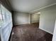 Open living room with large window and neutral decor at 675 Stonebridge Loop, Lithonia, GA 30058