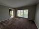 Inviting living room with large window and open floor plan at 675 Stonebridge Loop, Lithonia, GA 30058