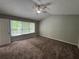 Spacious main bedroom with vaulted ceiling, carpet and natural light at 675 Stonebridge Loop, Lithonia, GA 30058