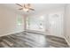 Inviting living room with a large window providing ample natural light and gray laminate flooring at 823 Catherine St, Forest Park, GA 30297