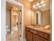 Bathroom featuring a granite countertop vanity, sink, mirror, and tiled floors at 100 Ashley Hall Ct, Woodstock, GA 30188