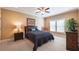 Bedroom features a plush, carpeted floor and a comfortable bed with a teal accent pillow at 100 Ashley Hall Ct, Woodstock, GA 30188