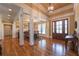 Elegant dining room featuring hardwood floors, coffered ceilings, and a stylish chandelier at 100 Ashley Hall Ct, Woodstock, GA 30188