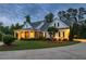 Inviting home with manicured lawn and a charming entryway, showcasing a perfect blend of brick and siding at 100 Ashley Hall Ct, Woodstock, GA 30188