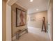 Hallway featuring unique artwork, bench, and door at 100 Ashley Hall Ct, Woodstock, GA 30188