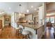 Bright kitchen with granite counters, stainless appliances, and hardwood floors at 100 Ashley Hall Ct, Woodstock, GA 30188