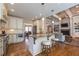 Open kitchen with stainless appliances, a center island, and a view to the living room at 100 Ashley Hall Ct, Woodstock, GA 30188