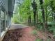 View of a private backyard with lush greenery and a small patio area, perfect for relaxation at 1048 Brandon Ln, Stone Mountain, GA 30083