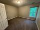 Another view of a bedroom with natural light, carpet, and closet, awaiting your personal touch at 1048 Brandon Ln, Stone Mountain, GA 30083