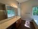 Large bathroom featuring double vanity, soaking tub, and natural lighting at 1048 Brandon Ln, Stone Mountain, GA 30083