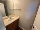 Cozy powder room featuring a vanity with mirror and neutral wall color at 1048 Brandon Ln, Stone Mountain, GA 30083