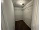 Walk-in closet with shelving and carpeted floor, providing ample storage space at 1048 Brandon Ln, Stone Mountain, GA 30083
