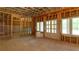 Unfinished basement with french doors and wood frame construction ready to be customized at 10765 Shallowford Rd, Roswell, GA 30075
