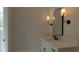 Bathroom with modern vanity, marble countertop, and contemporary lighting fixtures at 10765 Shallowford Rd, Roswell, GA 30075