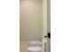 Bathroom featuring modern toilet, bidet, and white trim with a view of the natural surroundings at 10765 Shallowford Rd, Roswell, GA 30075