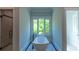 Elegant bathroom with a freestanding tub and a view of the trees outside at 10765 Shallowford Rd, Roswell, GA 30075