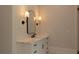 Well-lit bathroom with sleek vanity, marble countertop, and modern fixtures at 10765 Shallowford Rd, Roswell, GA 30075