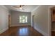 A bright and spacious bedroom with hardwood floors and an ample closet at 10765 Shallowford Rd, Roswell, GA 30075