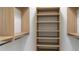 Organized walk-in closet featuring built-in shelving and ample storage space at 10765 Shallowford Rd, Roswell, GA 30075