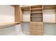 Walk-in closet with built-in shelving and drawers for maximum storage at 10765 Shallowford Rd, Roswell, GA 30075