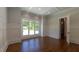 Empty room with large windows providing natural light and stylish trim at 10765 Shallowford Rd, Roswell, GA 30075
