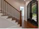 Elegant foyer featuring decorative iron doors and hardwood flooring at 10765 Shallowford Rd, Roswell, GA 30075