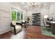 Bright office space with a large window and custom shelving at 10765 Shallowford Rd, Roswell, GA 30075